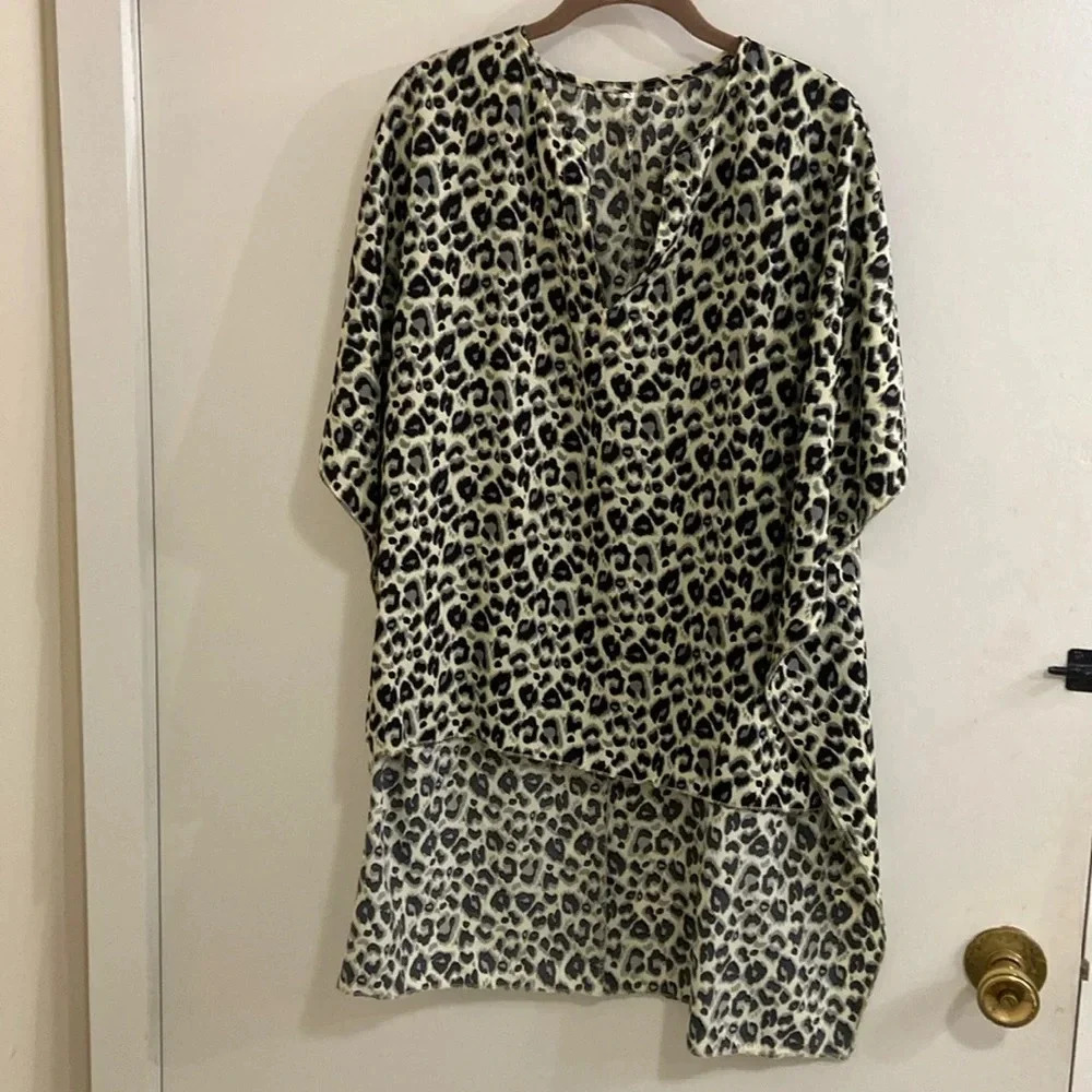 Size Small poncho over shirt short sleeve , black leopard print